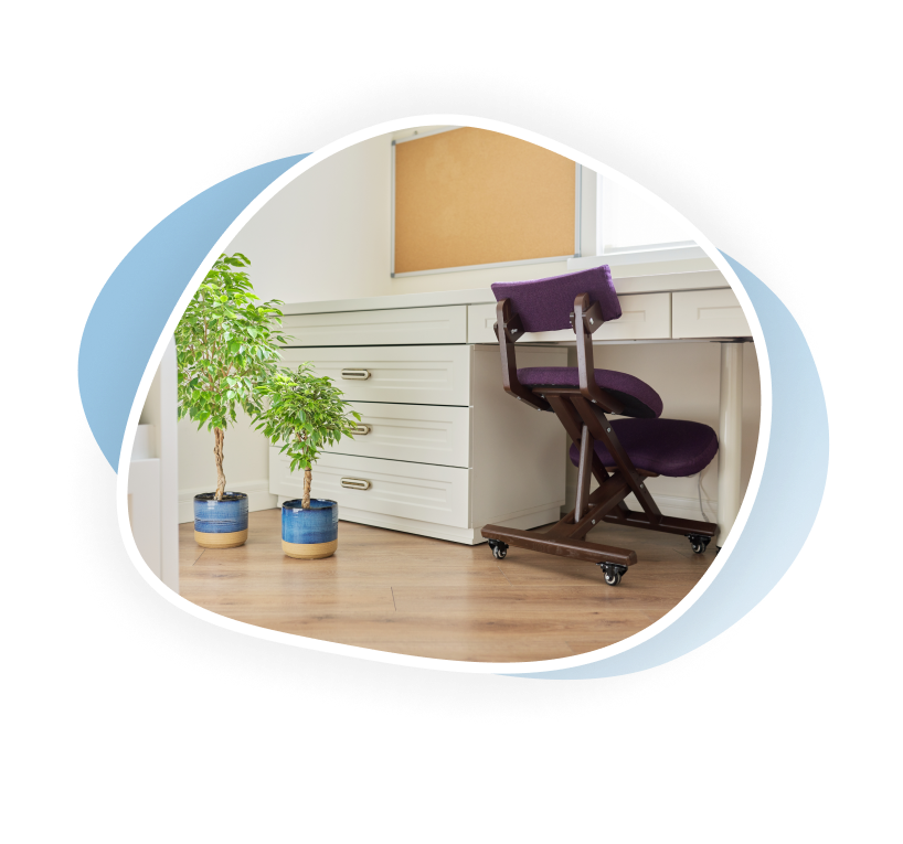 Furniture and desk surrounded by plants