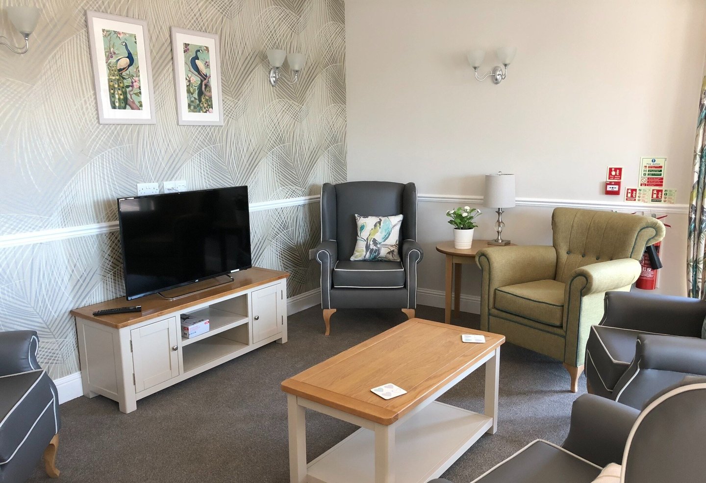 Lounge with armchairs, coffee table and other furniture