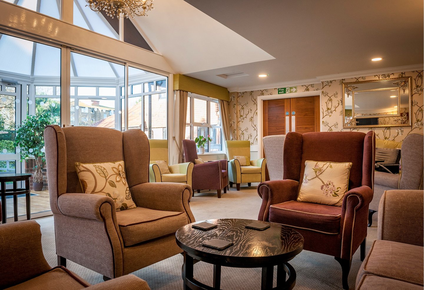 Large lounge with sofas and armchairs, including Gainsborough Chair