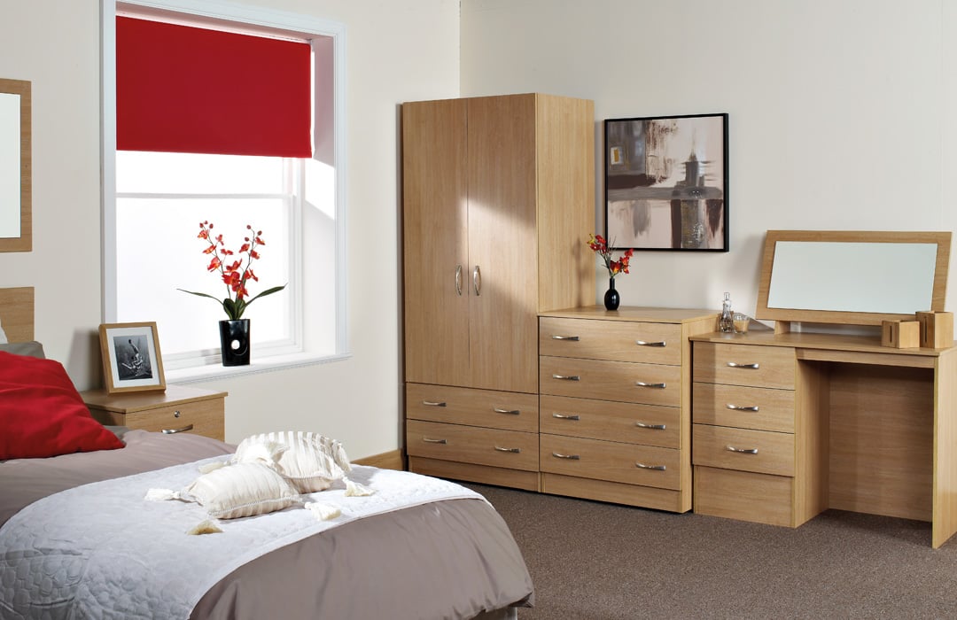 Bedroom with wooden furniture and bed