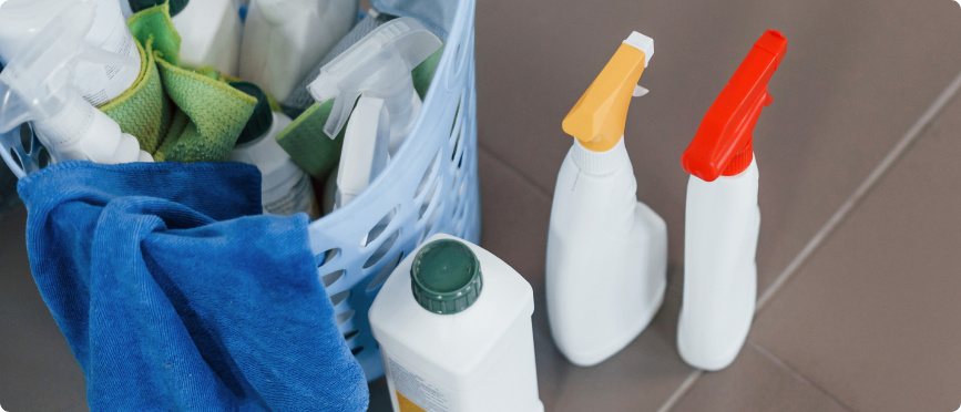 Close up of bottles with detergent and basket