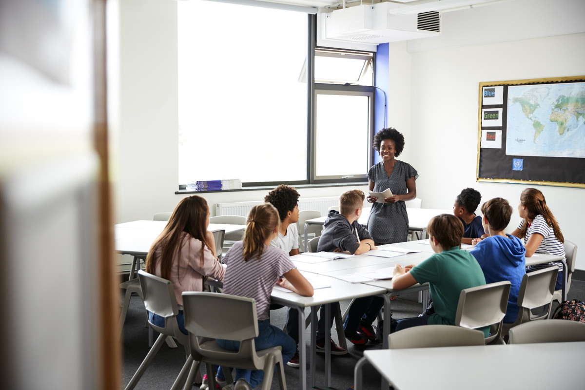 Female teacher with group of students